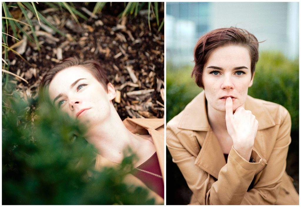 Kodak gold 200 portraits with girl laying in the bushes and leaning forward with finger on her mouth. 